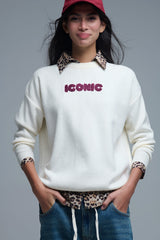 Embroidered ICONIC Sweater with Global Tour Back Print in Cream