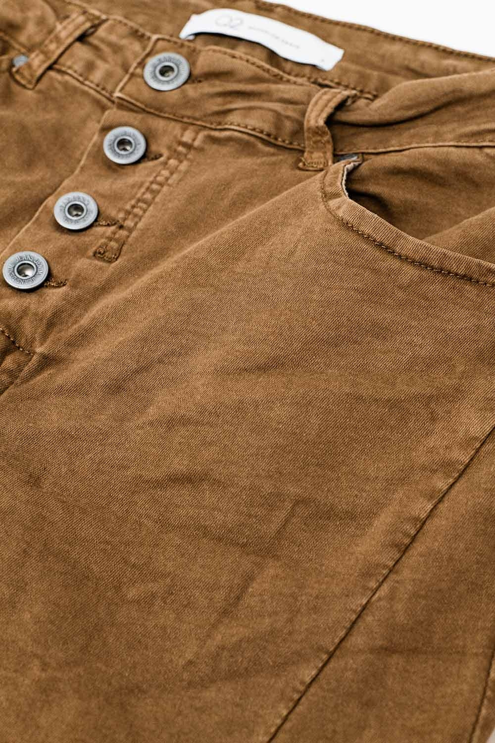 Exposed buttons skinny jeans in brown - Jeans