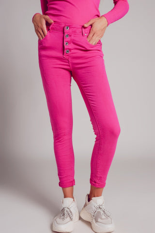 Exposed buttons skinny jeans in fuchsia