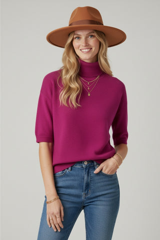 Fine knit sweater in fucsia with a high neck and elbow-length sleeves