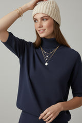Fine knit sweater in navy blue with a high neck and elbow-length sleeves
