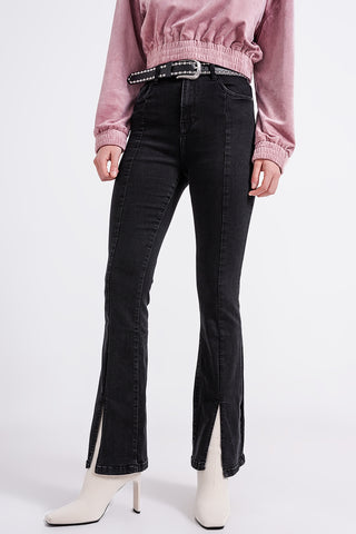 Flare black jeans with split hem