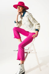 Flare jeans with raw hem edge in fuchsia
