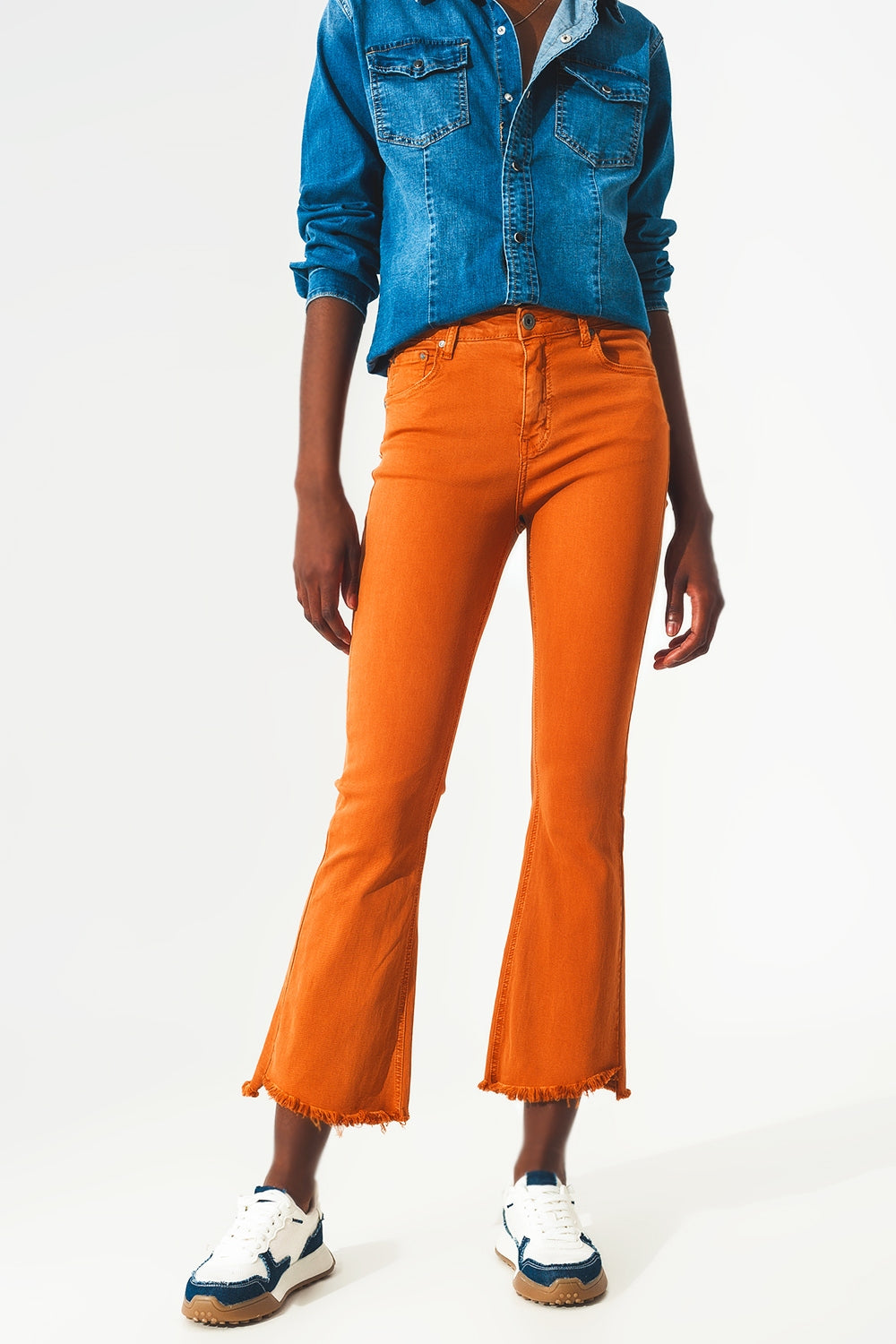 Flare jeans with raw hem edge in orange - Jeans
