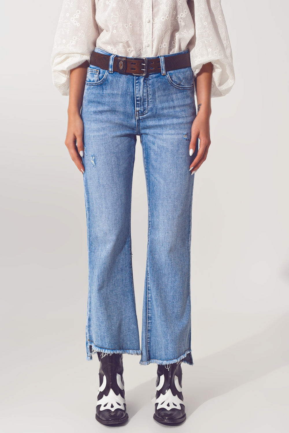 Flared Jeans in Light Blue with Asymmetric Hem - Jeans