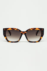 geometric polarized sunglasses with gradient dark lenses and tortoise shell