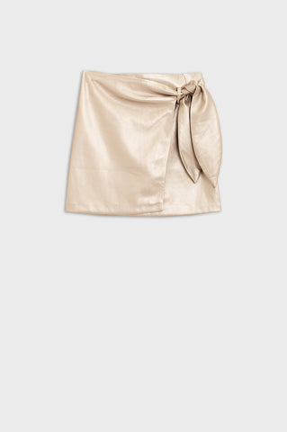 Gold faux leather mini skirt with bow on the side