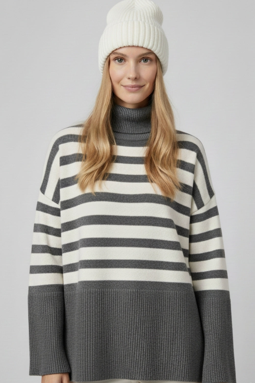 Gray oversized turtleneck sweater with white stripes and splits on the side -