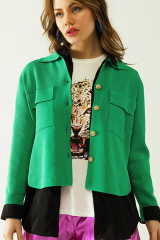 Knitted cardigan with chest pockes and golden buttons in green