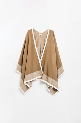 Knitted poncho in camel with ecru trim