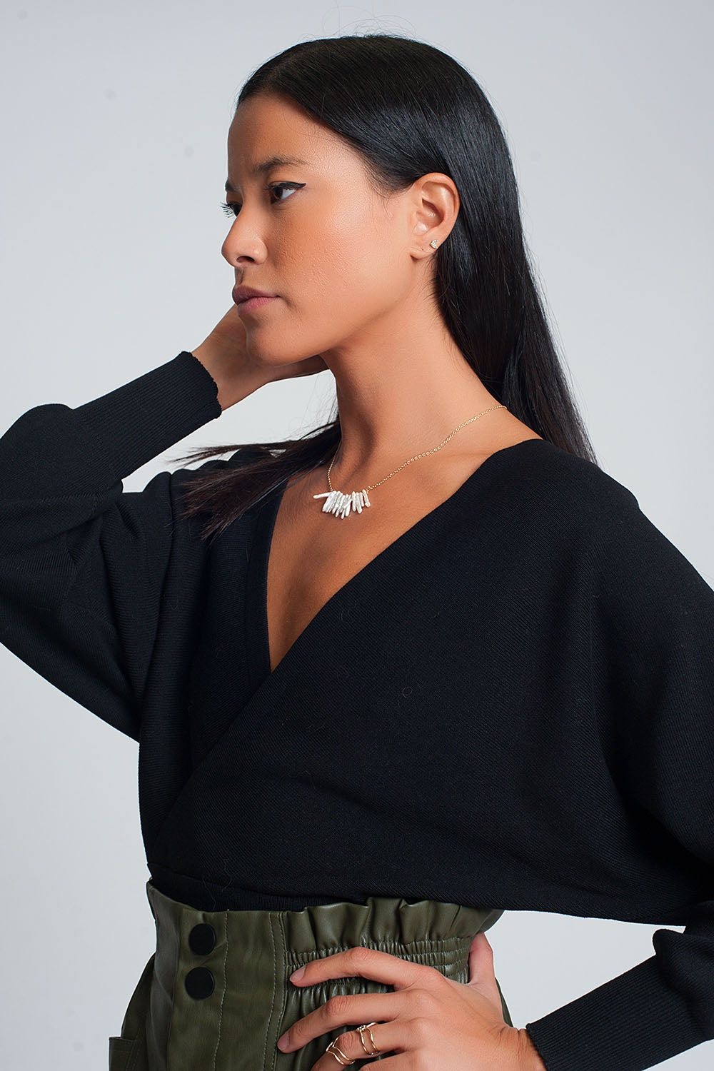 Knitted sweater with wrapped V-neck in black - Jumpers