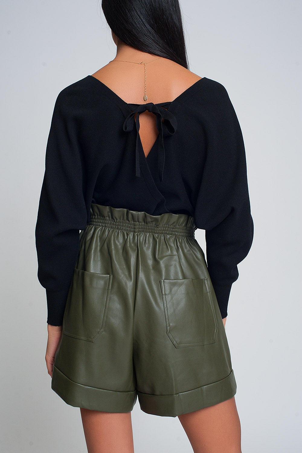 Knitted sweater with wrapped V-neck in black - Jumpers