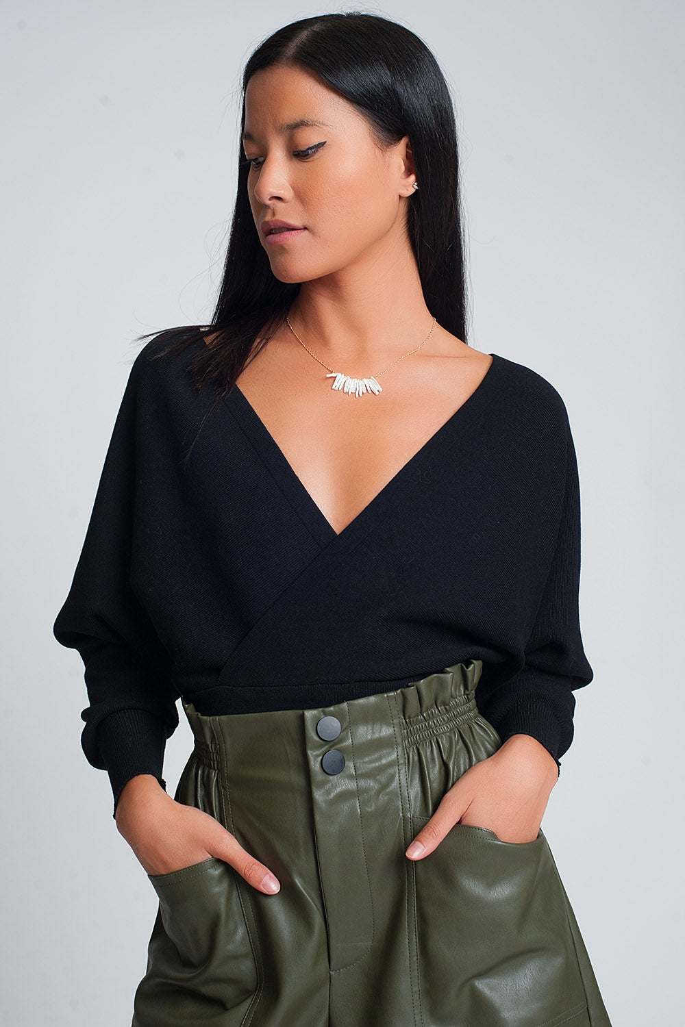Knitted sweater with wrapped V-neck in black - Jumpers