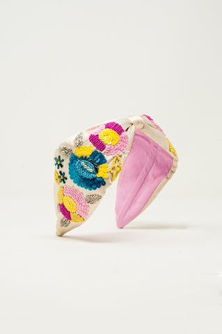 Knotted headband with embellished flowers in cream