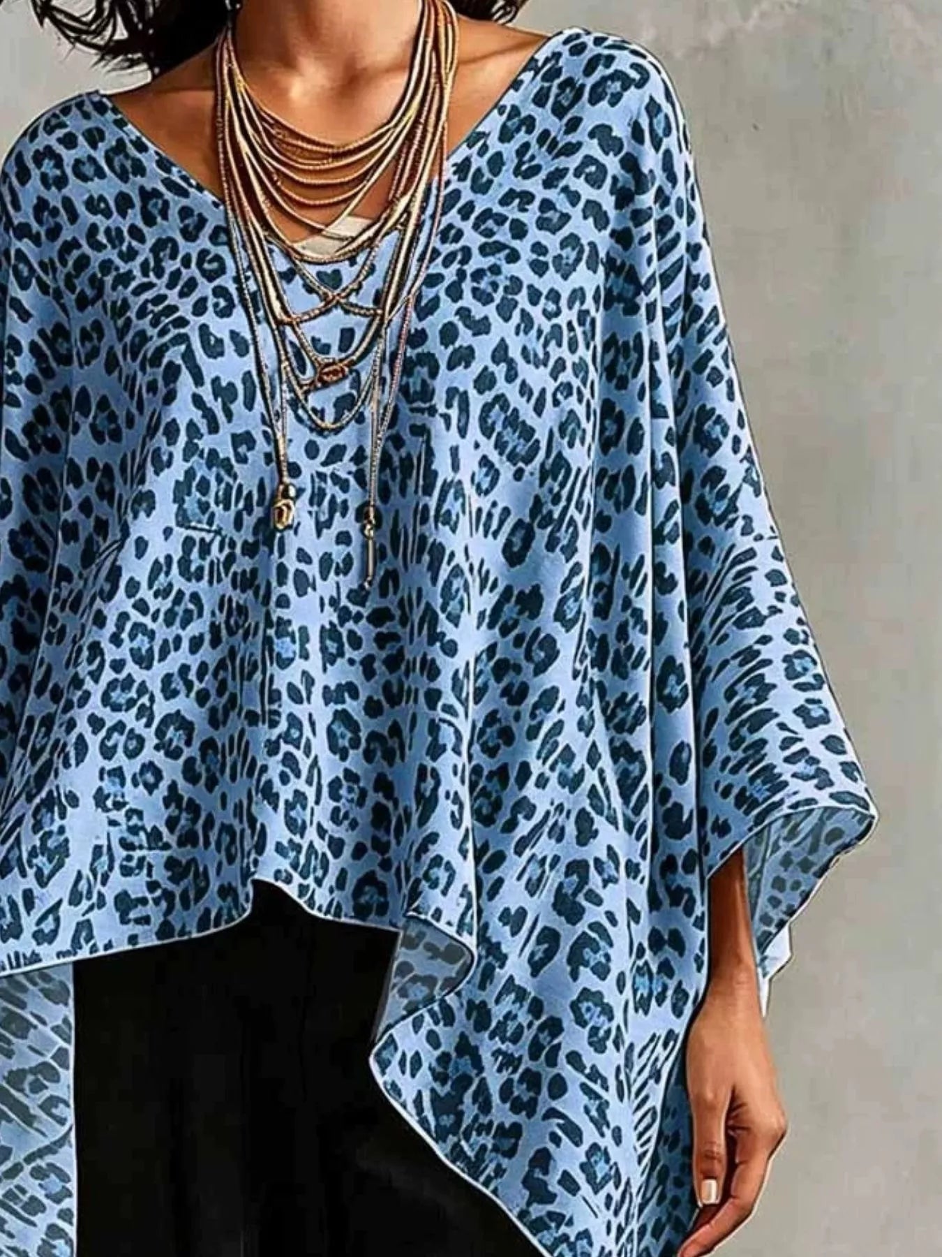 Trendsi leopard print asymmetrical hem top in blue with flowing design and stylish layered necklace