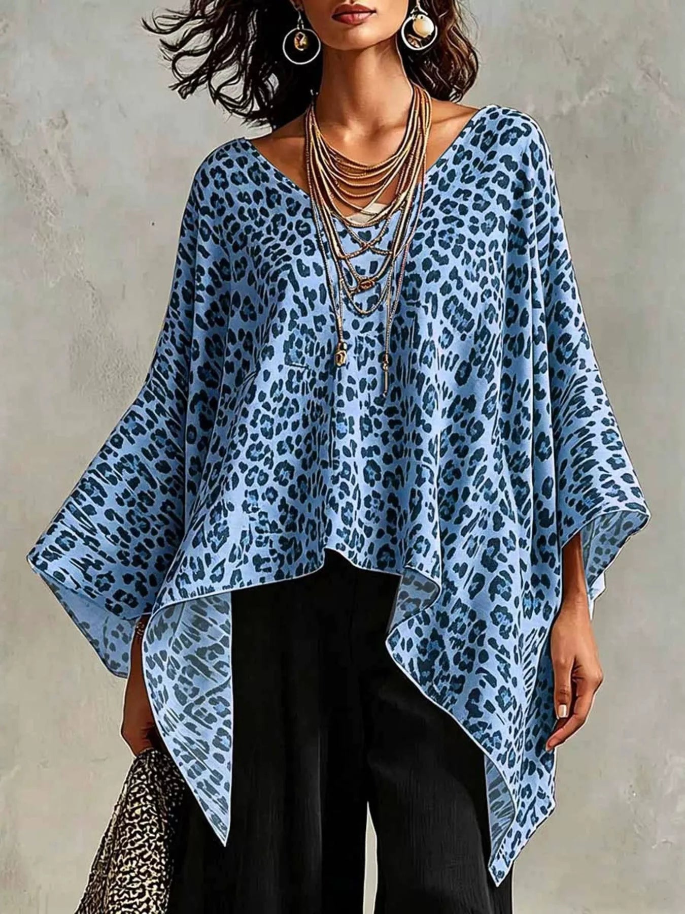 Trendsi leopard print asymmetrical hem top in blue with flowing sleeves and a stylish design