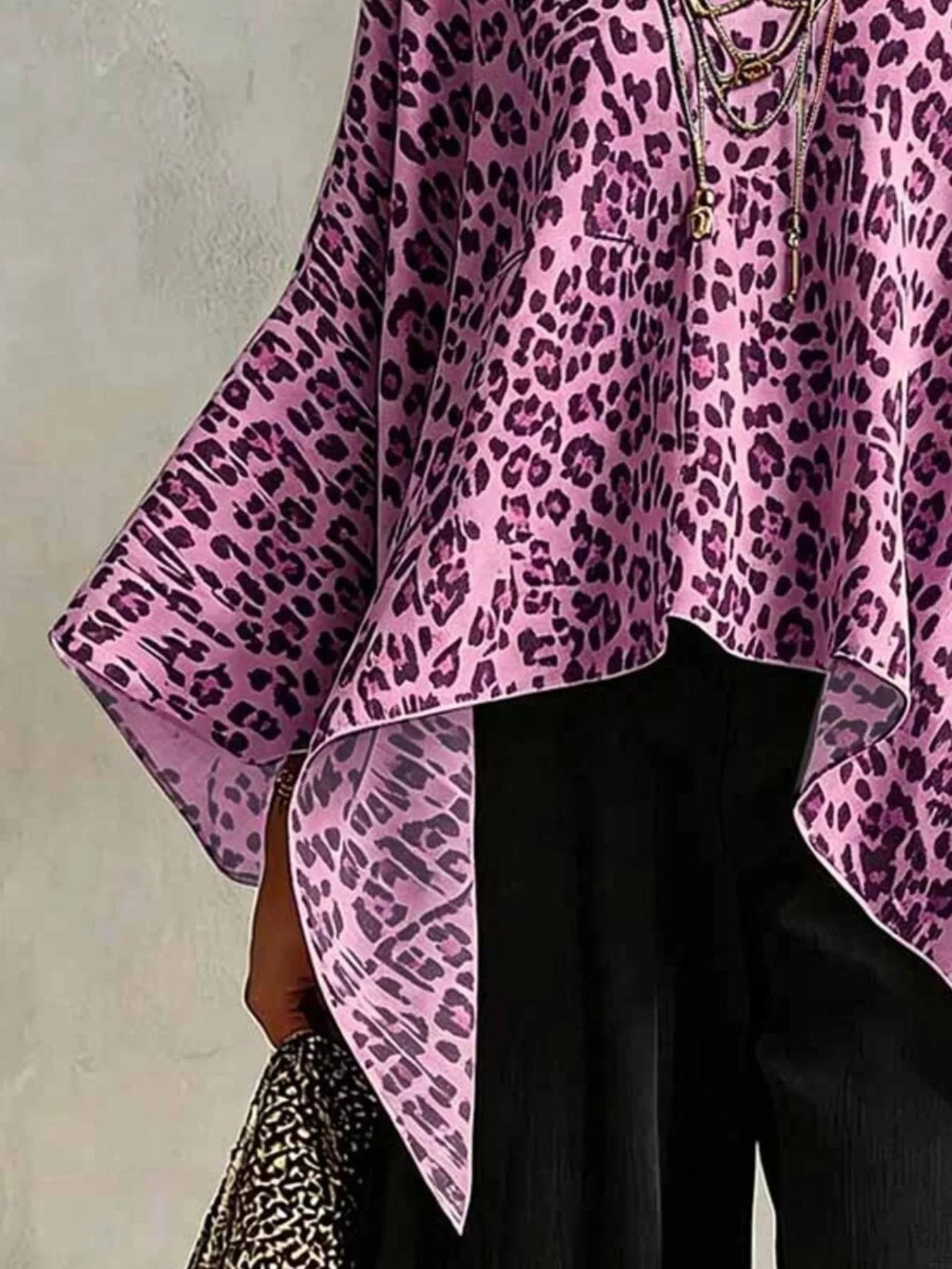 Trendsi leopard print asymmetrical hem top in purple with flowy sleeves and chic design