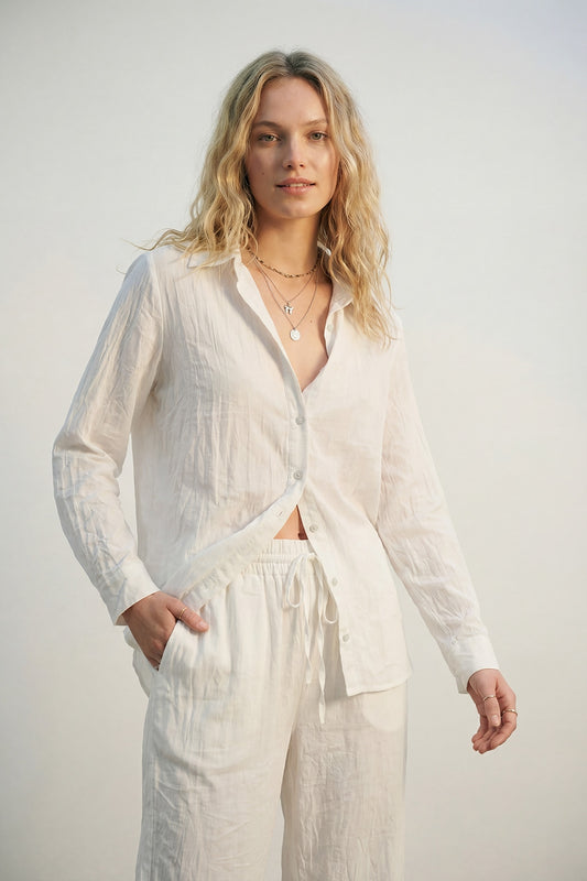 Q2 lightweight crinkled shirt with relaxed silhouette in cream, featuring a button-up design and long sleeves.