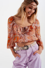 Long sleeve sheer top with shirred waist and tie detail in orange