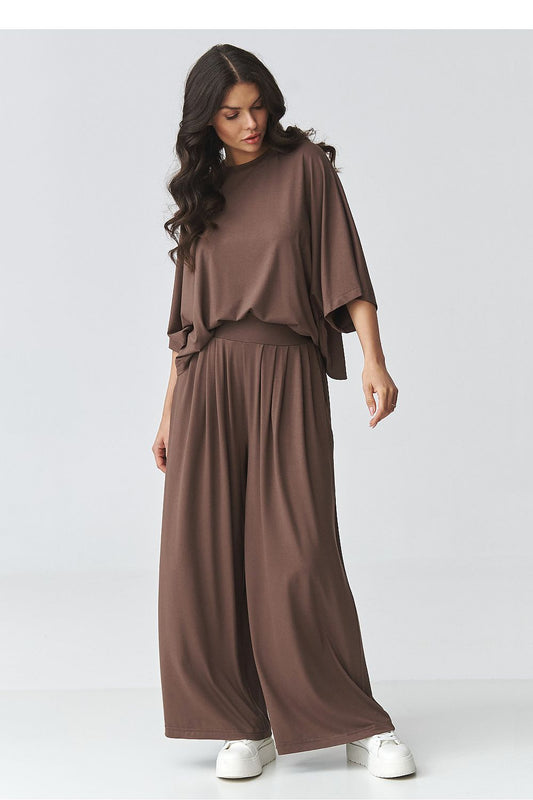 Makadamia outfit set featuring a loose-fitting blouse and wide-leg trousers in brown