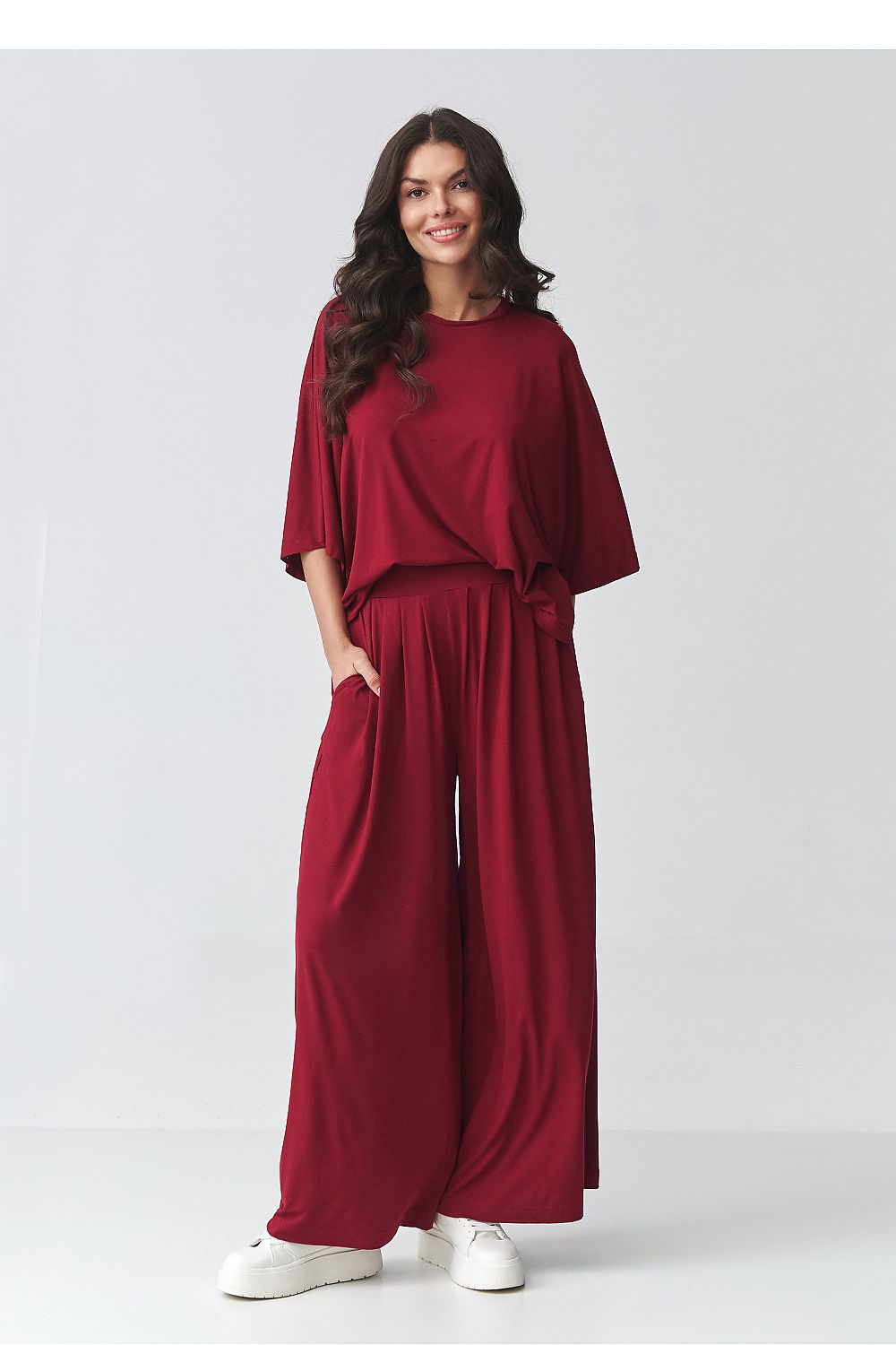 Makadamia loose-fitting blouse outfit set in burgundy with wide-leg trousers for a stylish look
