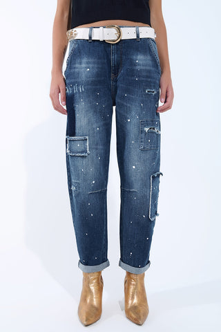 Loose-fitting jeans with distressed patches and paint details