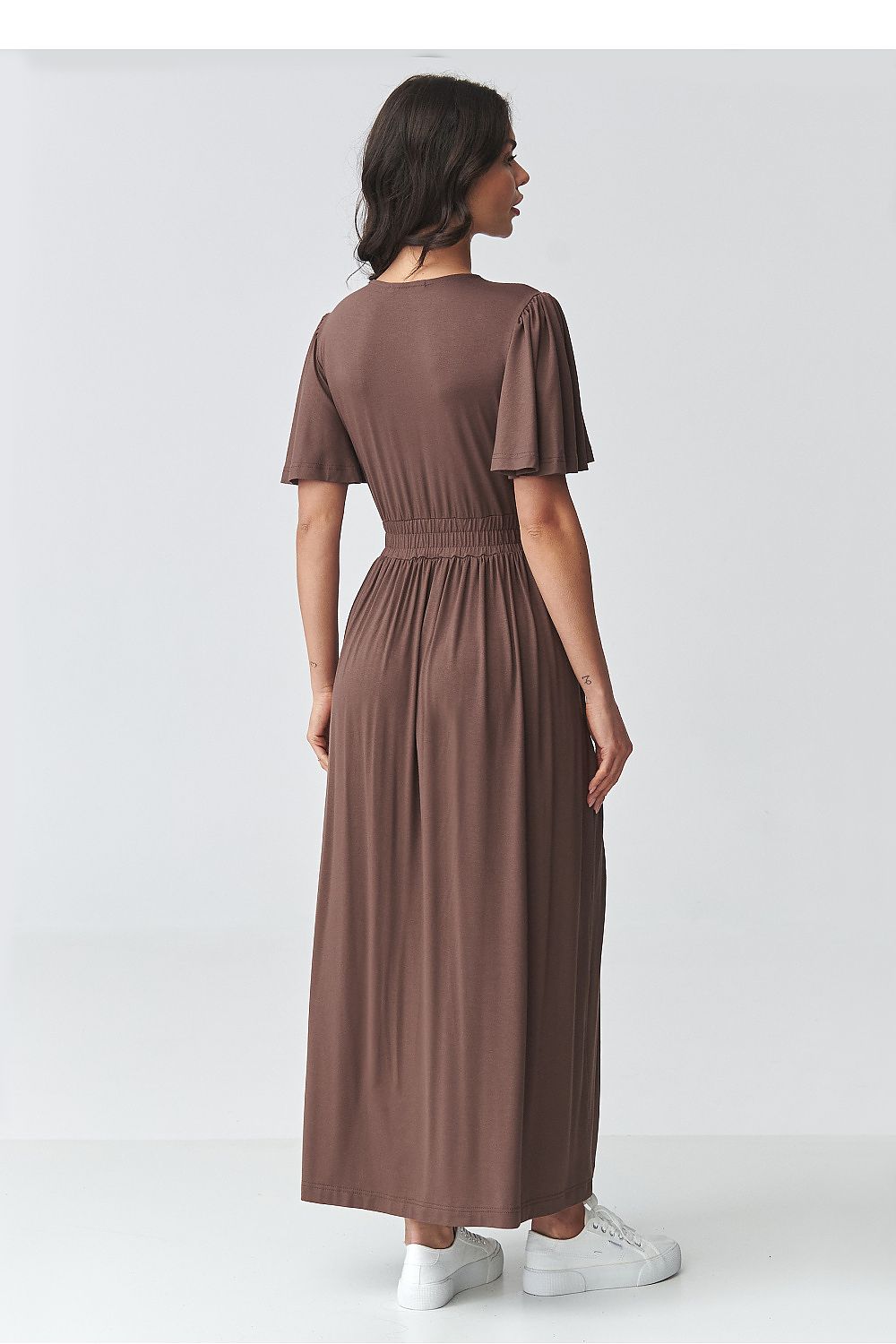 Back view of Makadamia brown maxi dress with puff sleeves and elastic waist for a comfortable fit