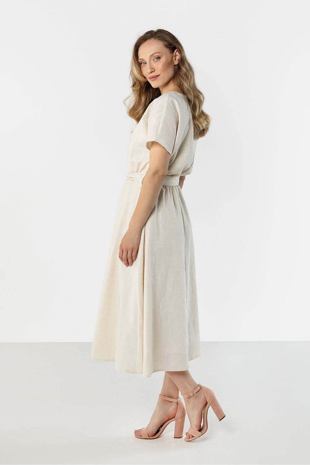 Awama midi flared bottom dress in cream with a flattering silhouette and elegant belt detail
