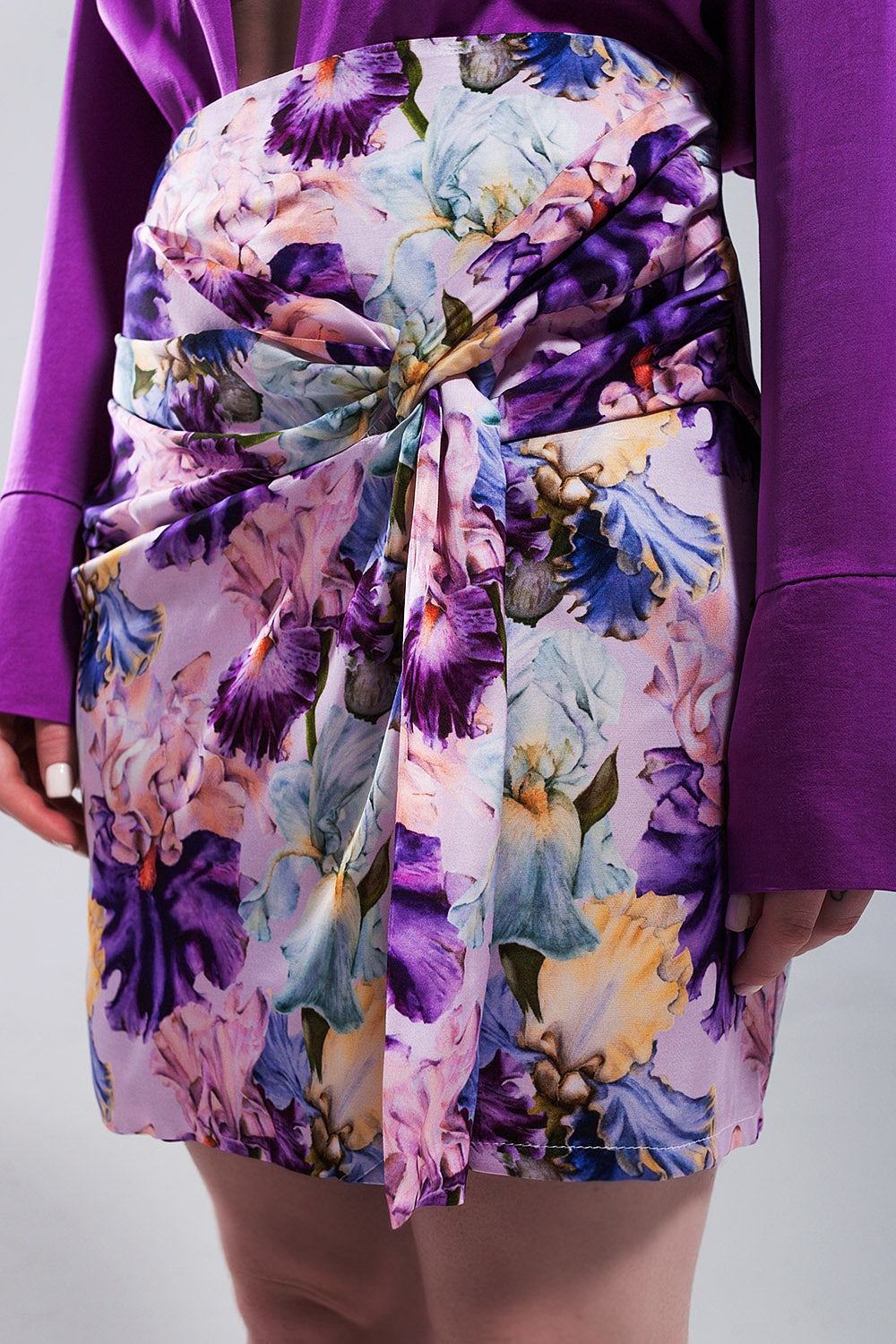 Mini skirt with knot front in purple clashing floral print - Skirts