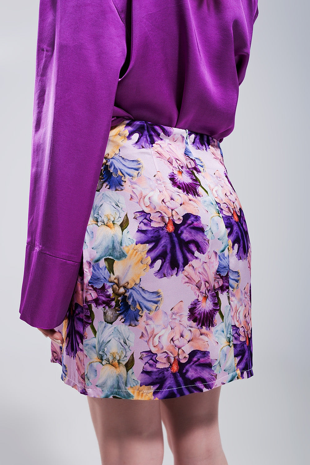 Mini skirt with knot front in purple clashing floral print - Skirts
