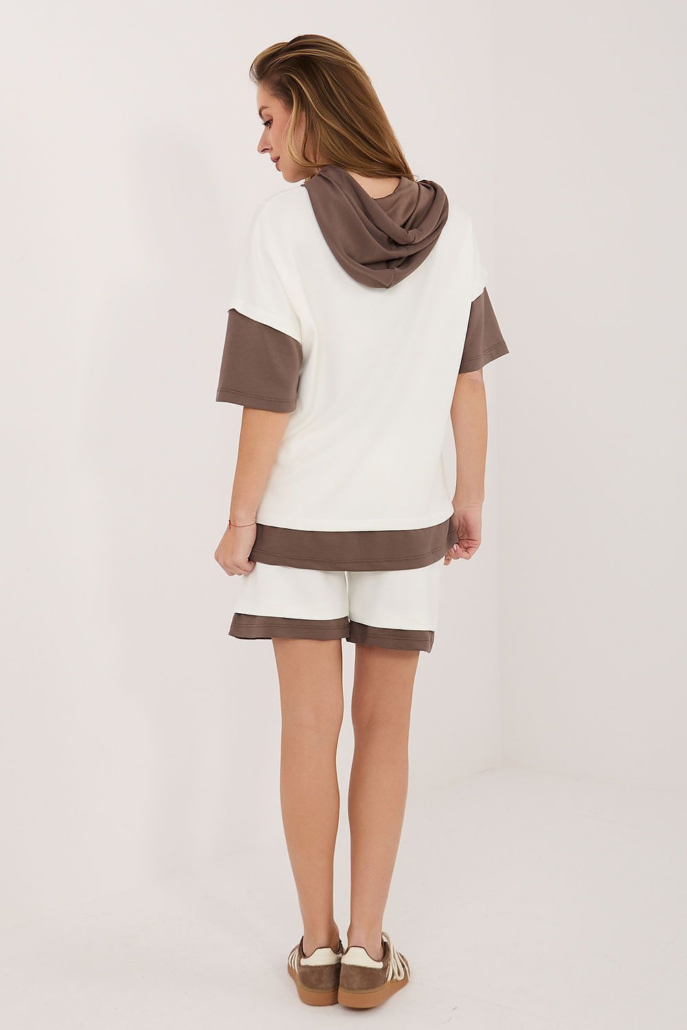 Rue Paris outfit set featuring a white top with brown accents and matching shorts for casual style