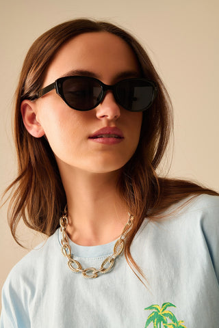 Lunettes de soleil ovales à monture noire