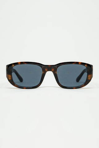 Lunettes de soleil ovales avec monture transparente brillante en marron