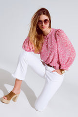 Blusa de chiffon rosa com estampa floral e mangas longas de balão