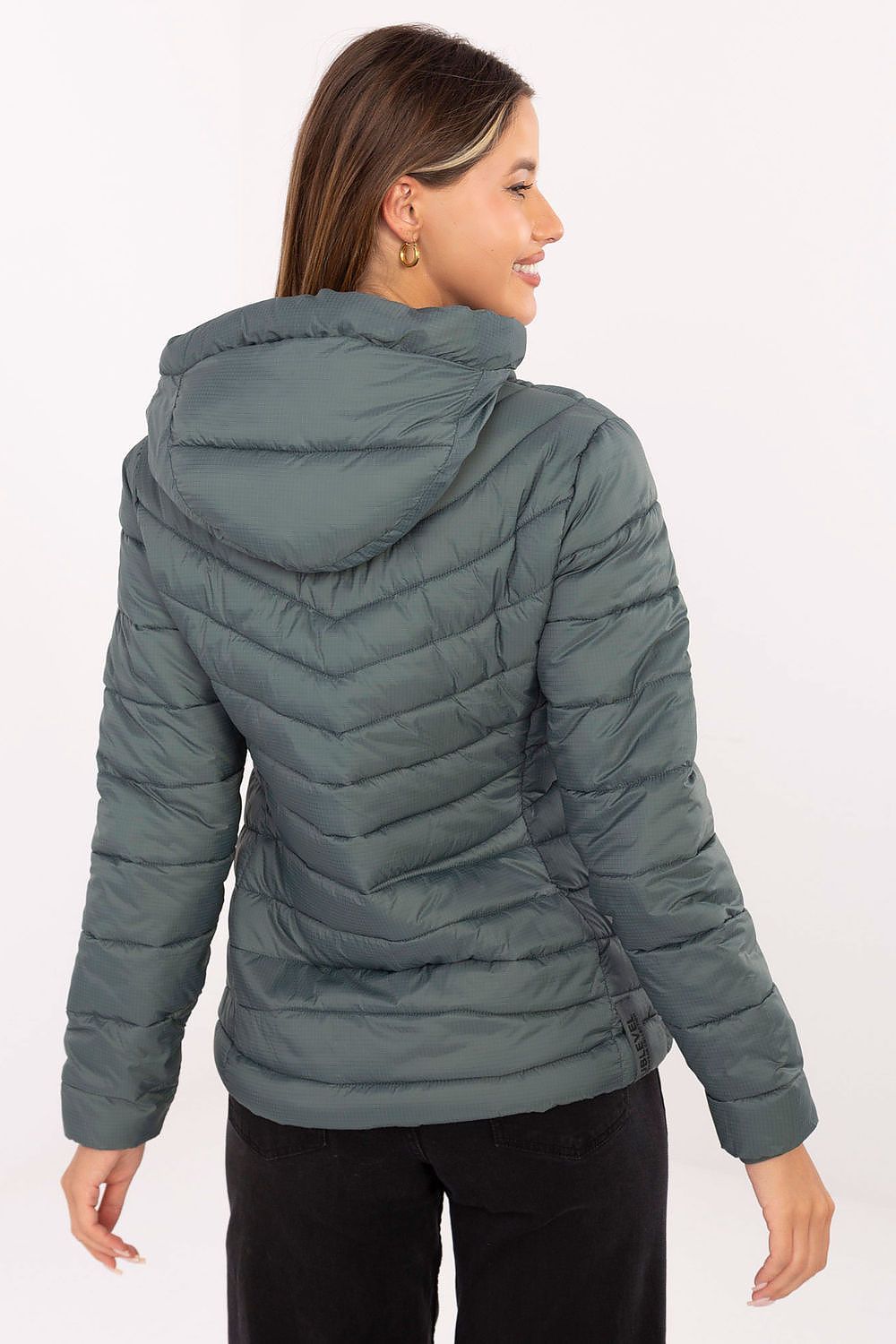 Sublevel quilted transitional jacket in green with a stylish hood and comfortable fit, perfect for layering.