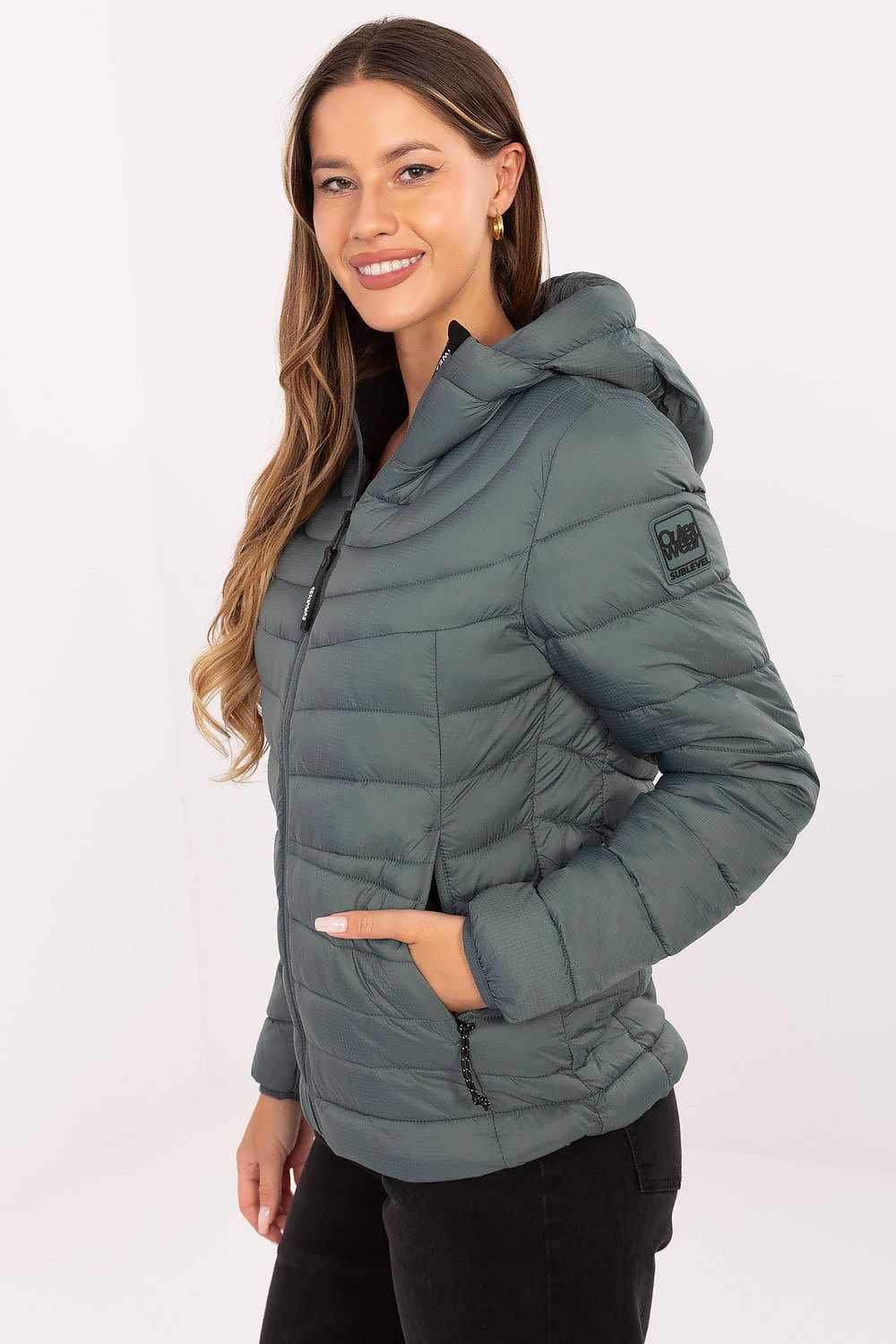 Sublevel quilted transitional jacket with a hood and side pockets for stylish warmth