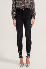 Raw hem skinny jeans in washed black
