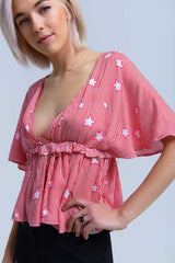 Top vermelho com estrelas e babados