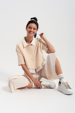 Relaxed wide leg trousers in plisse cream