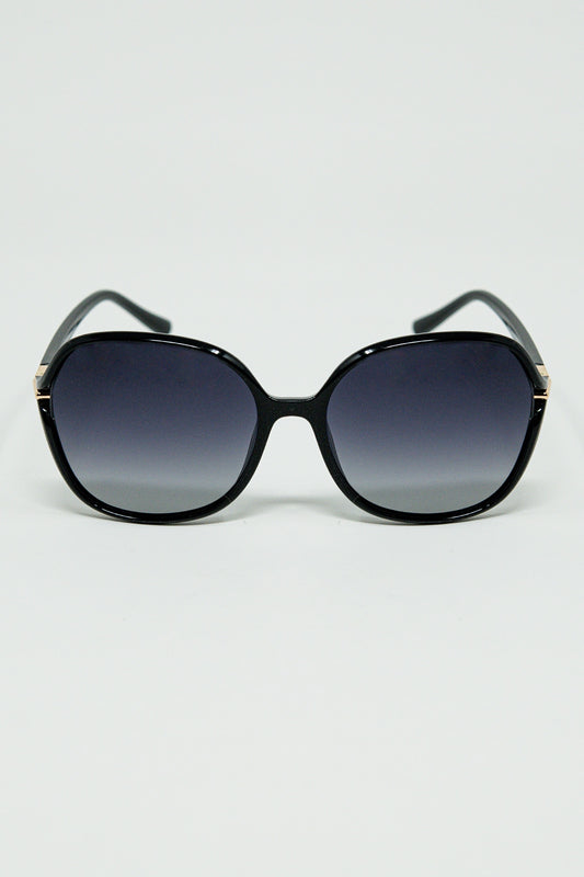 Round sunglasses in black with gold metal detail - Sunglasses