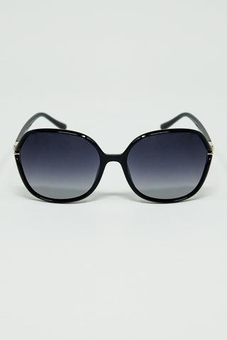 Round sunglasses in black with gold metal detail