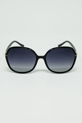 Round sunglasses in black with gold metal detail