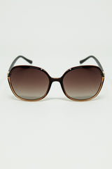 Round sunglasses in caramel color with gold metal detail