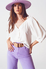 Chemise boutonnée en satin couleur crème