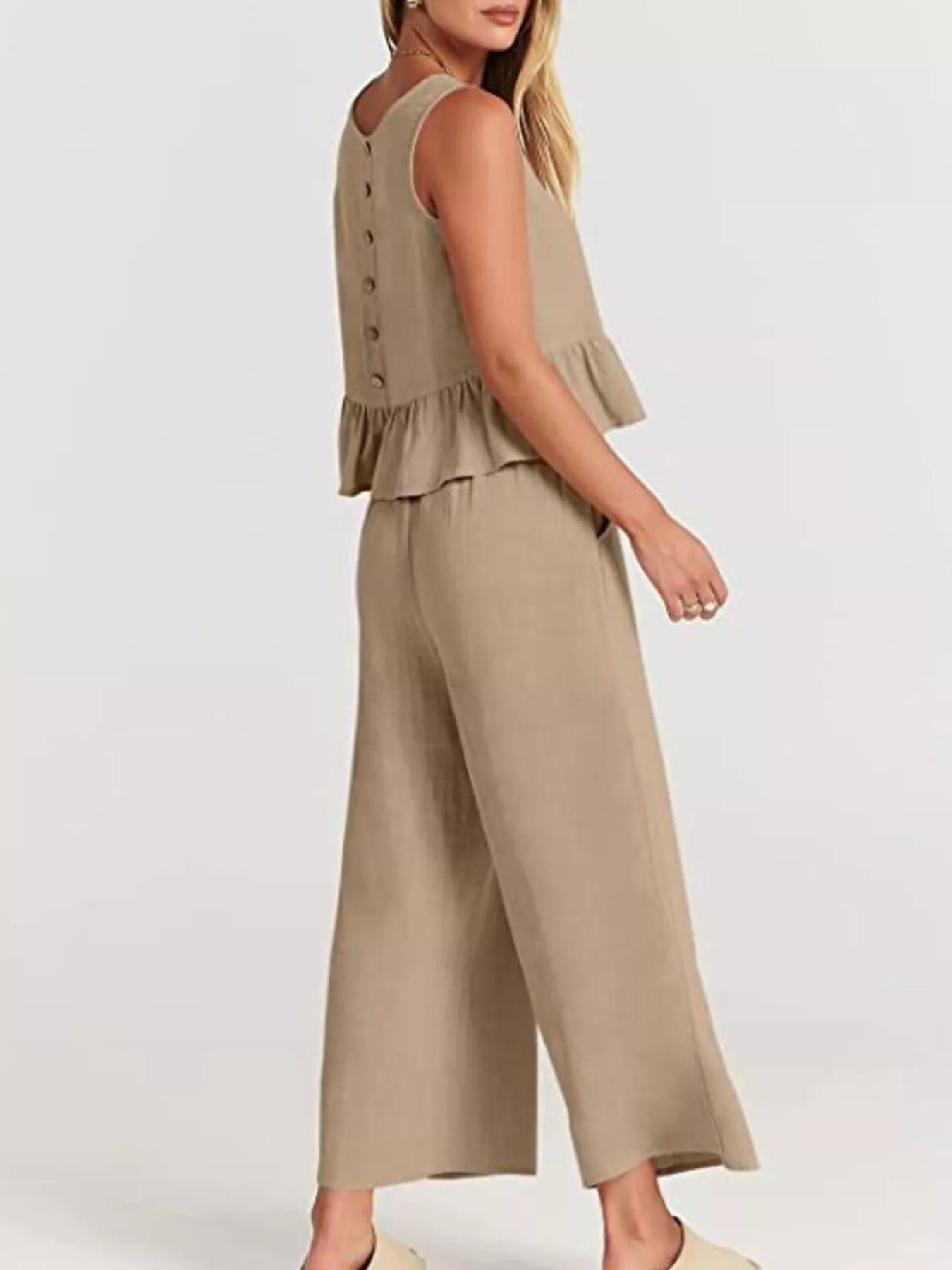 Trendsi set plus size featuring a stylish peplum top and wide-leg trousers in neutral beige