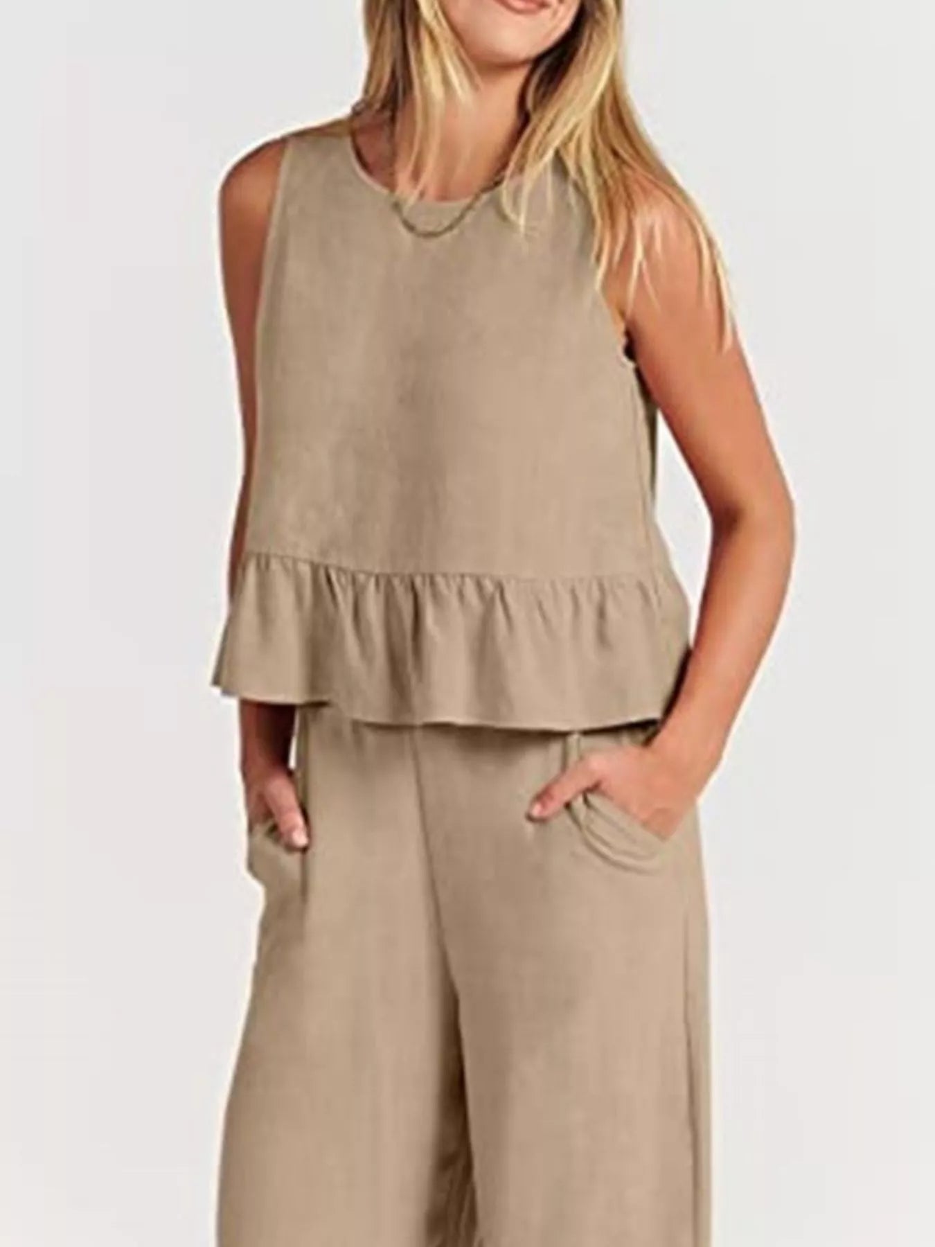 Trendsi set plus size featuring a trendy sleeveless top with a ruffled hem and comfortable pants