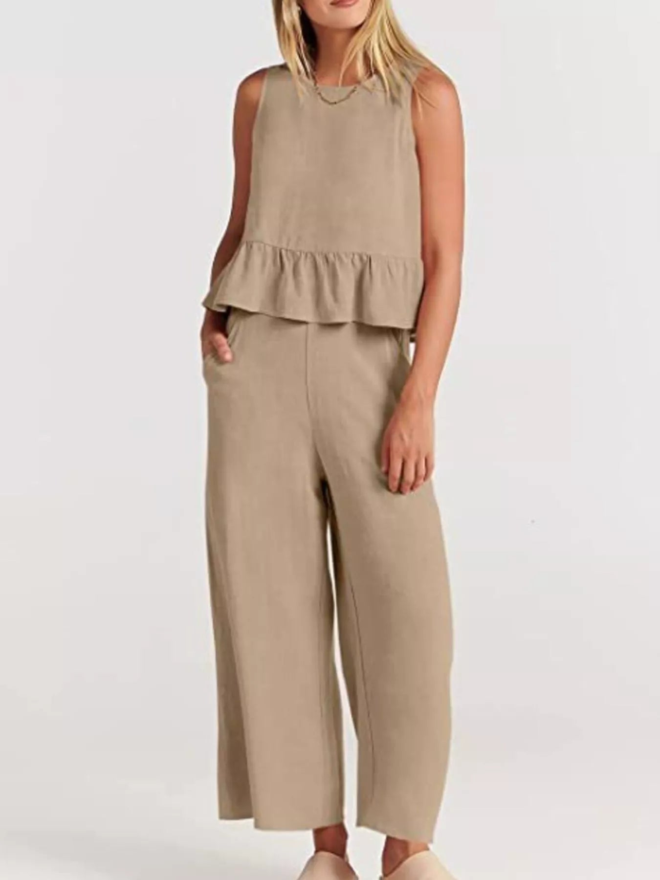 Trendsi set plus size featuring a stylish sleeveless top with peplum detail and wide-leg trousers