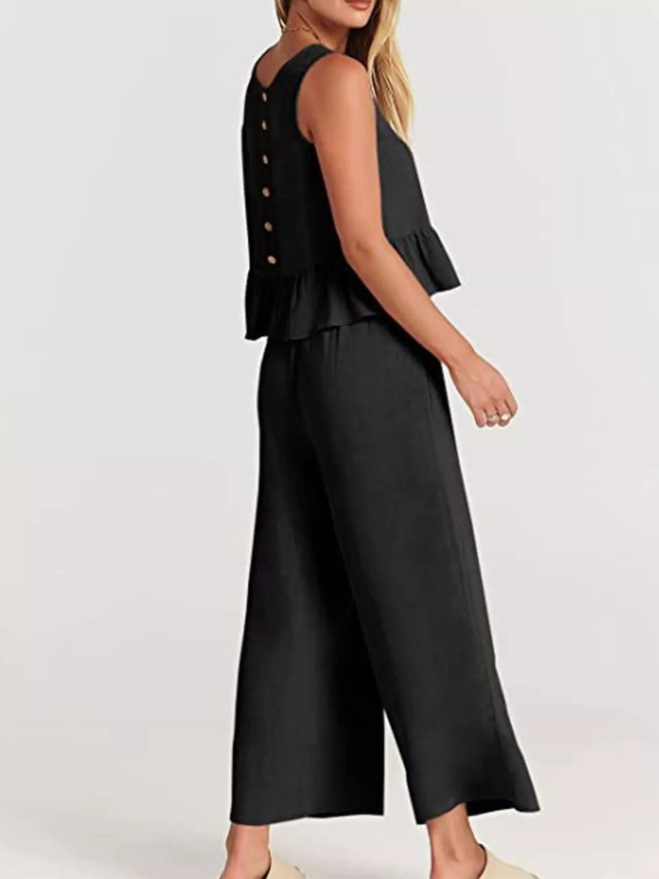 Trendsi stylish black set plus size with a peplum top and wide-leg trousers