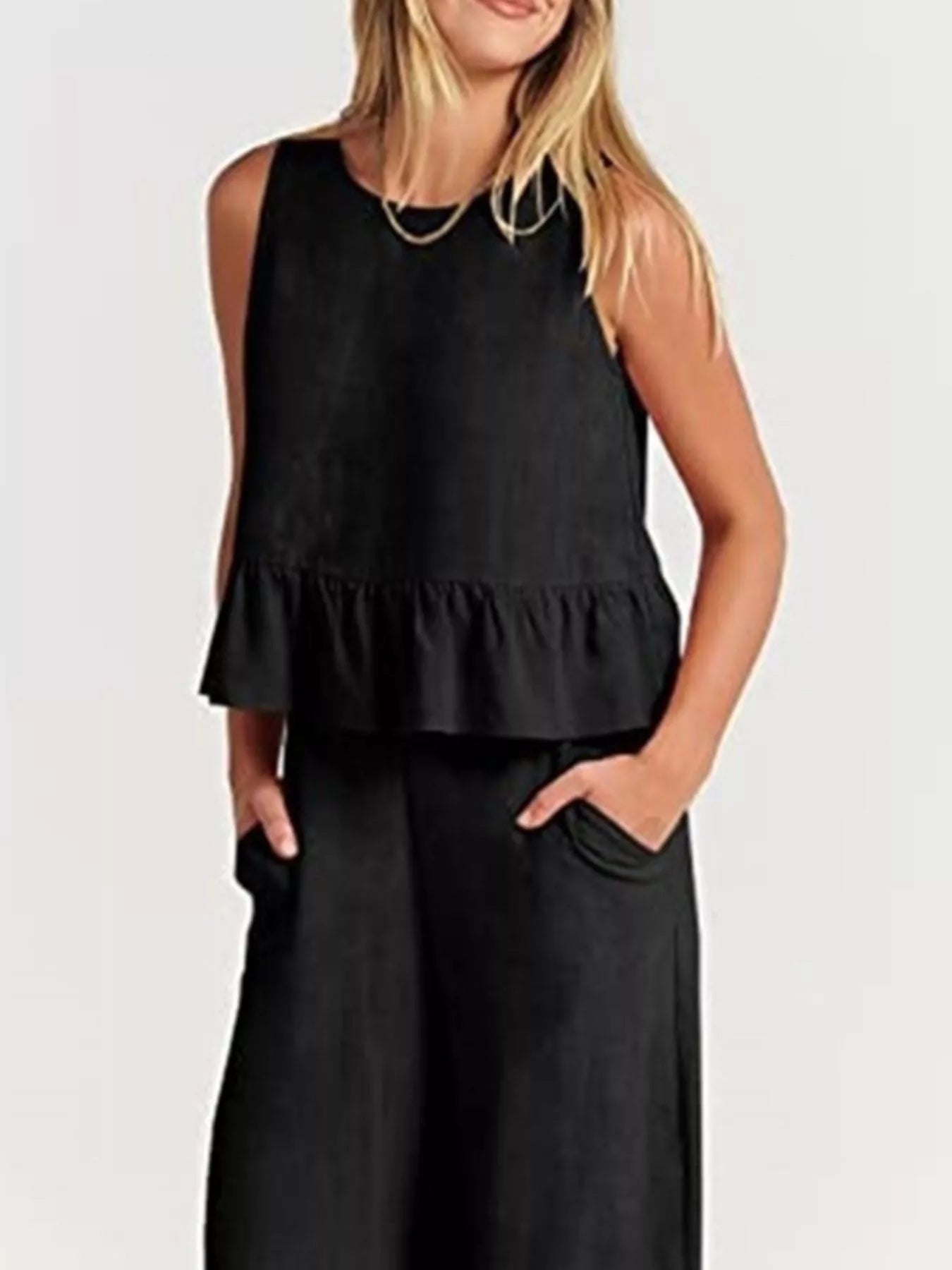 Trendsi set plus size featuring a stylish black sleeveless top with a ruffled hem and pockets