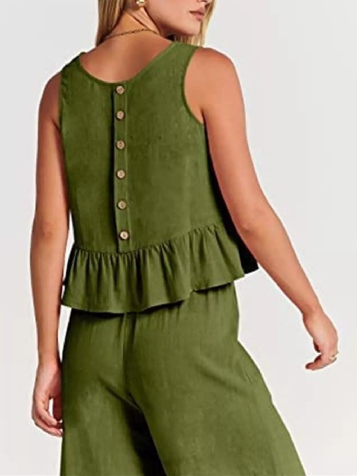 Trendy green plus size set featuring a peplum top with button details and matching bottoms